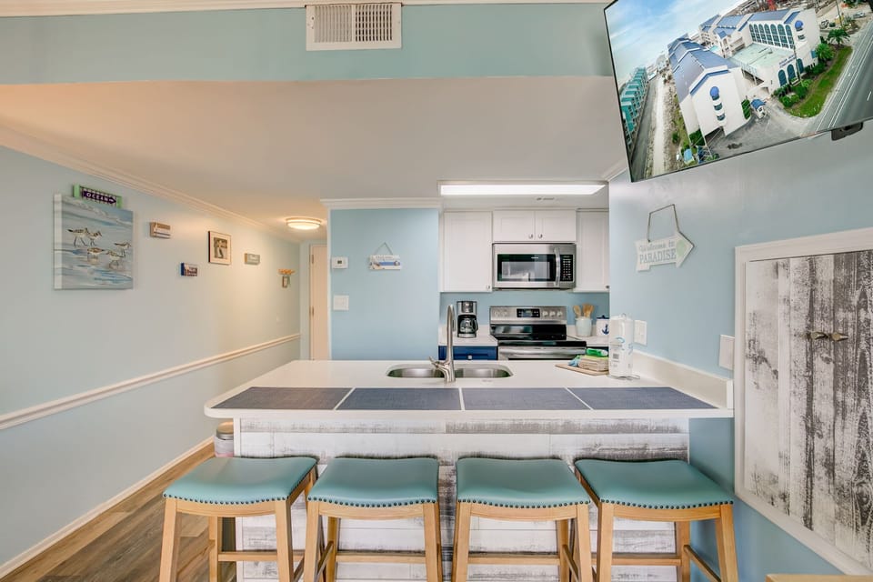 Kitchen are with seating to accommodate four.