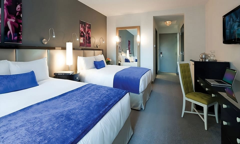 Settle in comfortably with two inviting beds and a work desk