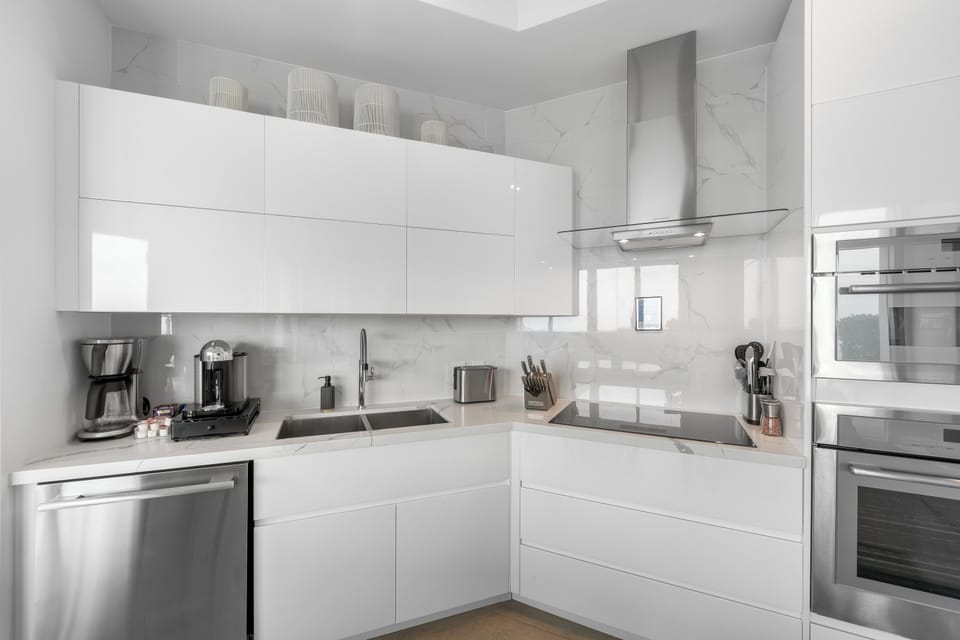 Kitchen with drip coffee and Nespresso machine. 
