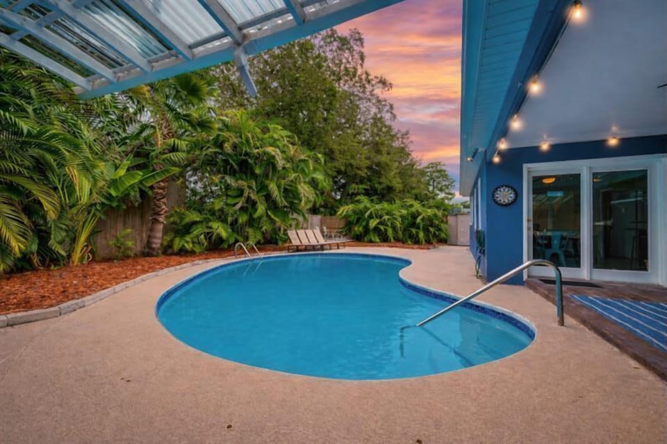 Enjoy evening swims under warm string lights, tropical greenery for privacy, and a sleek indoor-outdoor flow. Perfect for relaxing nights, morning dips, and laid-back vacation moments in your own serene retreat.