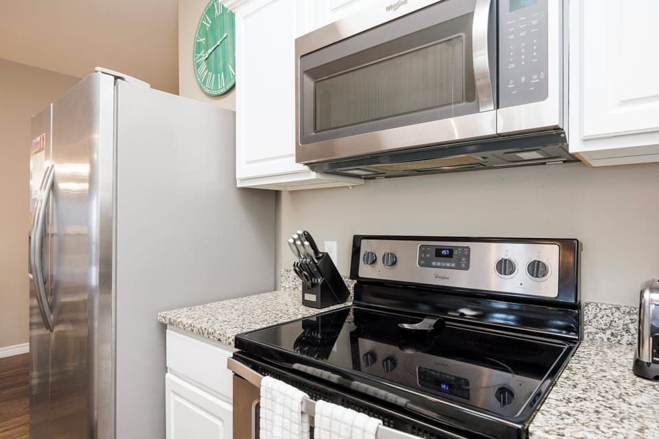 Your fully equipped kitchen awaits with granite countertops, stainless steel appliances, and everything you need to prepare delicious meals during your stay.