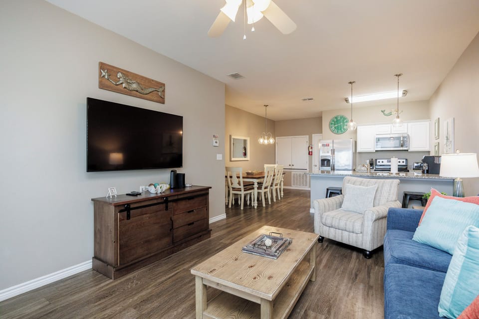 Your spacious open-plan retreat combines comfort and style, where you can unwind on plush seating while enjoying modern entertainment and home-cooked meals.
