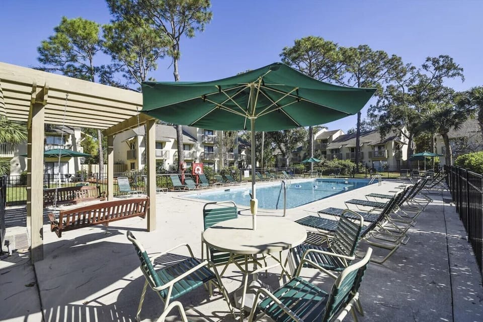 Relax by the pool with plenty of lounge chairs, shaded seating, and even a cozy porch swing. Whether you`re soaking up the sun, enjoying a refreshing swim, or unwinding in the shade, this is the perfect spot to recharge after a day at the beach!