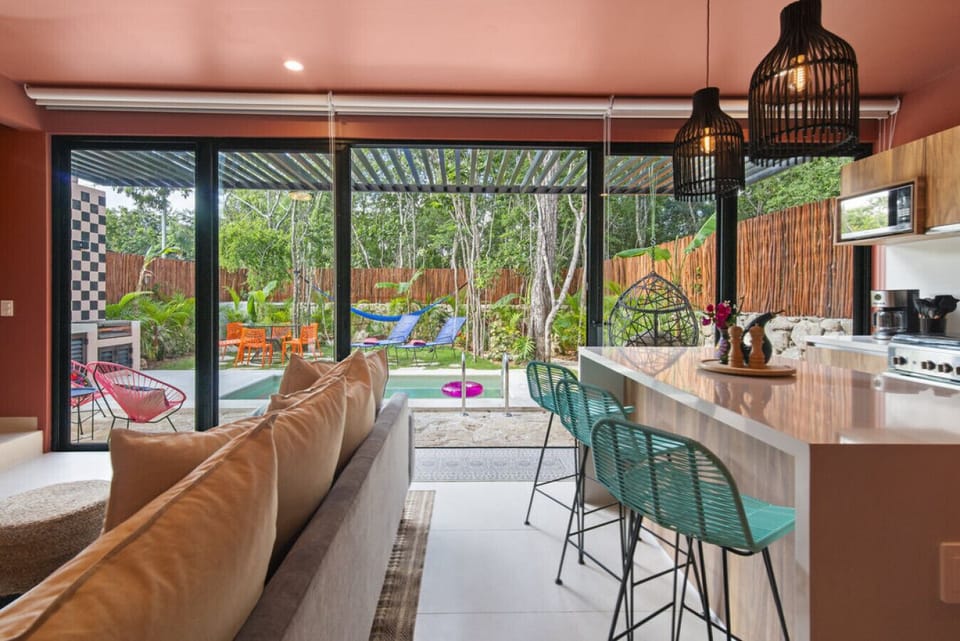 living area, bar, kitchen, pool/yard