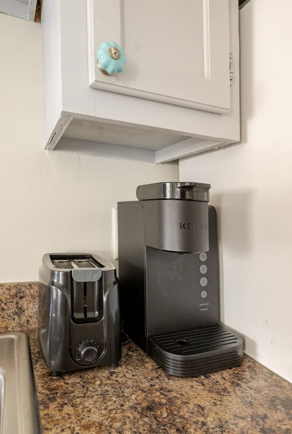 Keurig and toaster. Also a small coffee maker for those that prefer drip.