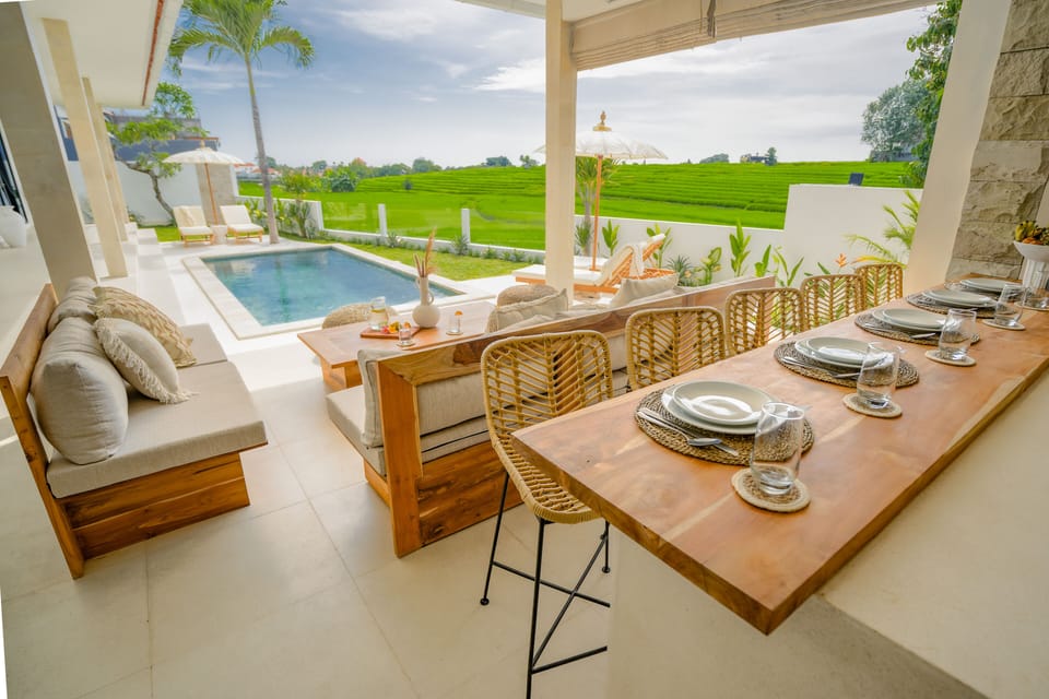 Open living and dining overlooking the pool.