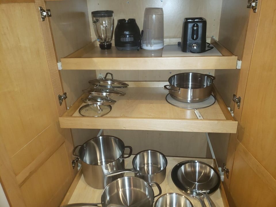 Fully stocked kitchen including basic appliance such as blender, toaster, toaster oven, coffee pot, and kettle