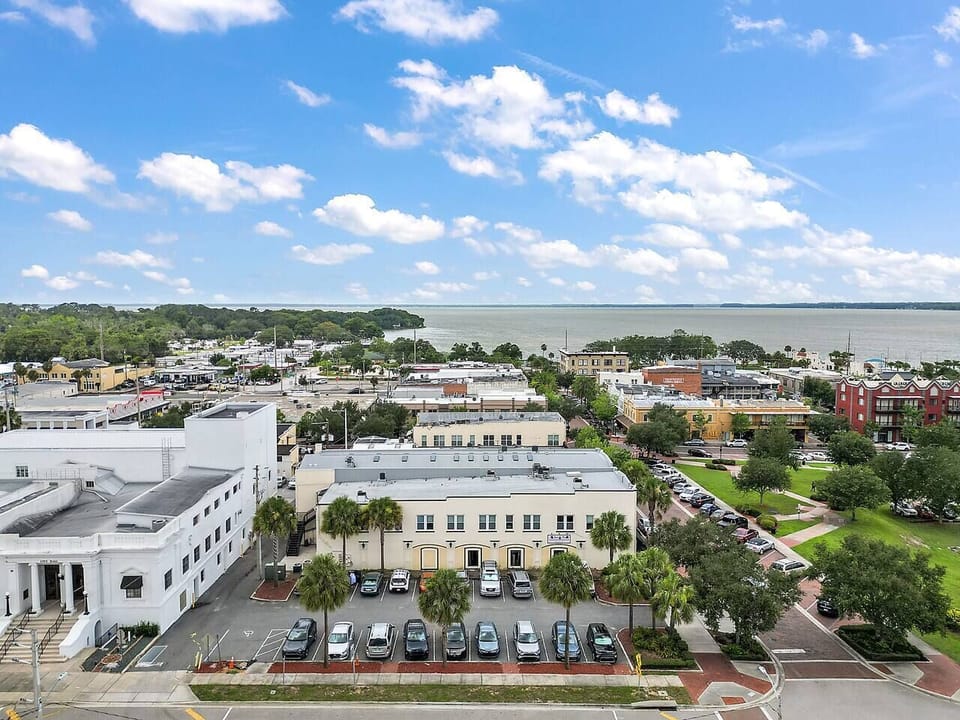 That's Lake Eustis right up the street, just a quick walk from your apartment for gorgeous sunrises and sunsets. Plus there's a playground here for the littles.