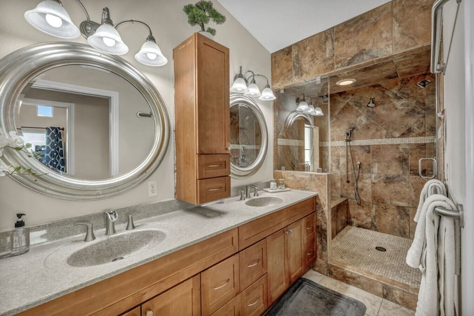 Pamper yourselves in the oversized master shower with a relaxing rain shower head and invigorating wall streams!