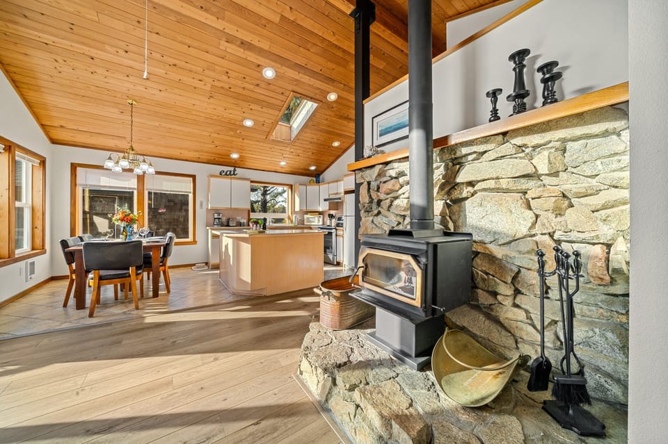 Open living space with dining room and kitchen. Upstairs open living area with access to the deck. Woodstove, Smart TV, WIFI, DVD, Books