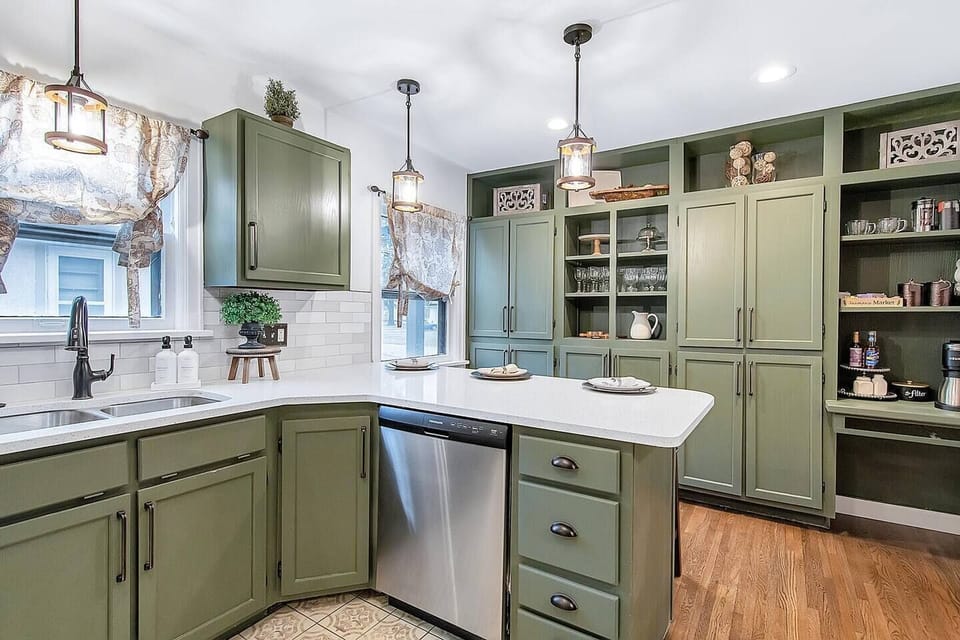 Beautiful kitchen with  quartz countertops, new appliances, under cabinet lighting (that changes colors!), bar and tons of storage!