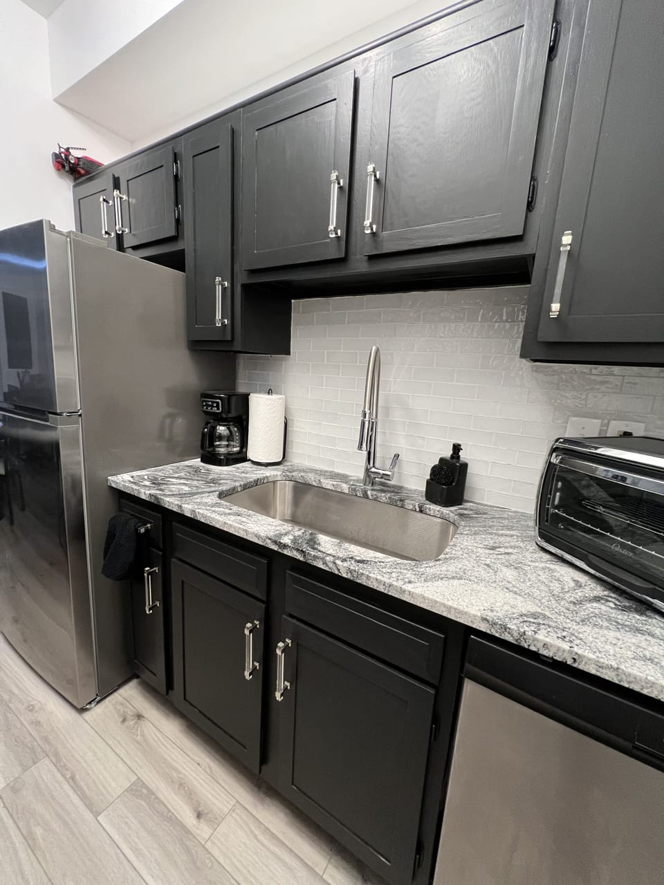 Newly renovated kitchen with granite countertops.
