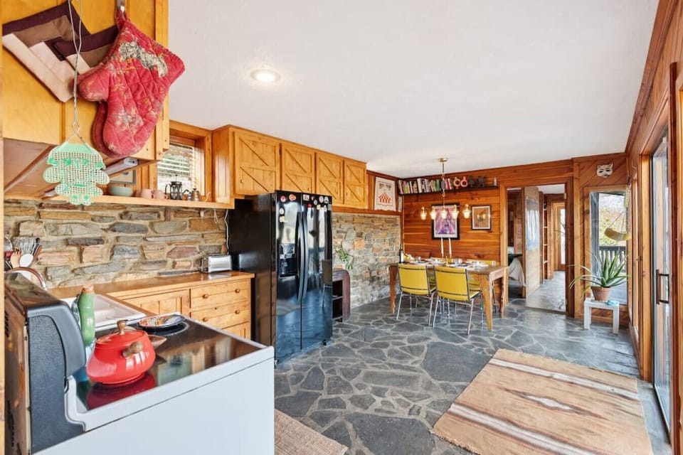 Full kitchen off the living room, fully-stocked with every cooking utensil & all the dish ware you might need. Dining area with seating for 4.