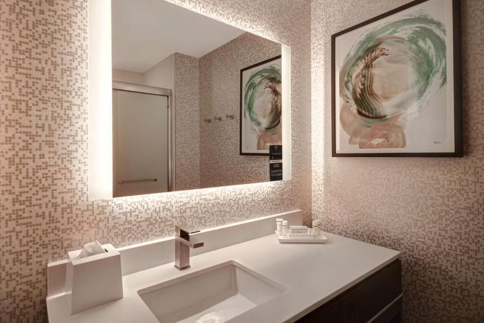 Get ready effortlessly with glowing mirror light and ample counter space.