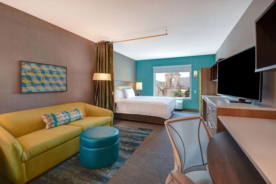Stretch out in the spacious suite with sofa and work desk.