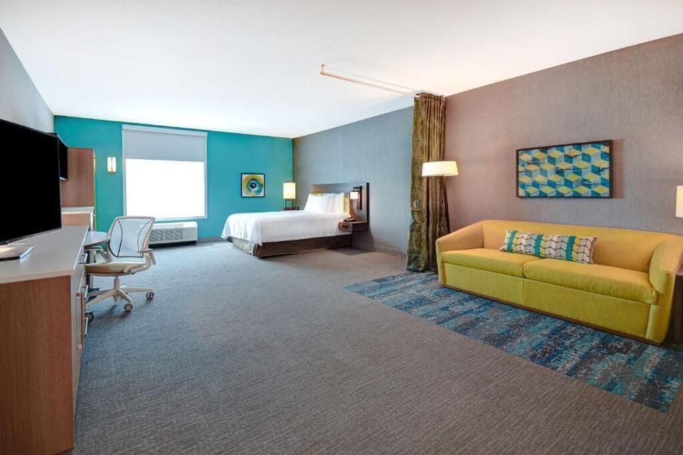 Relax into crisp bedding and warm lamp light at bedtime.