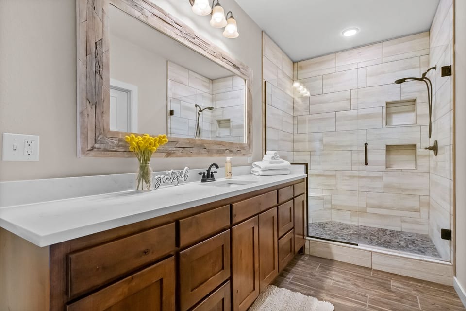 Private en suite primary bathroom with oversized, walk-in, tile shower!