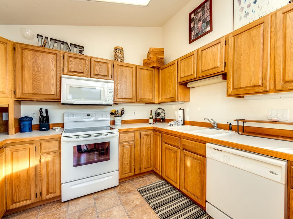 Fully equipped kitchen open to the dining room.