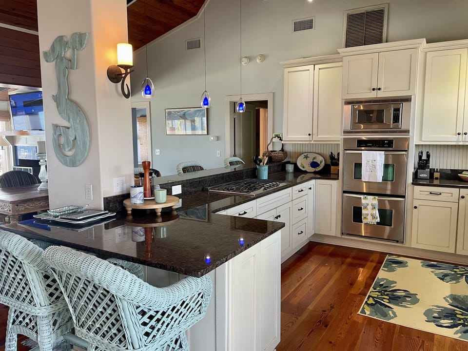 Kitchen with Double ovens, Viking gas stove,and nearly silent dishwasher.