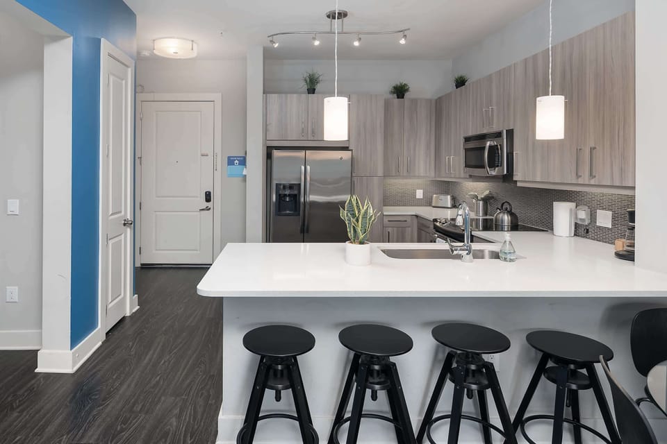 Fully stocked kitchen with cooking essentials and dining table