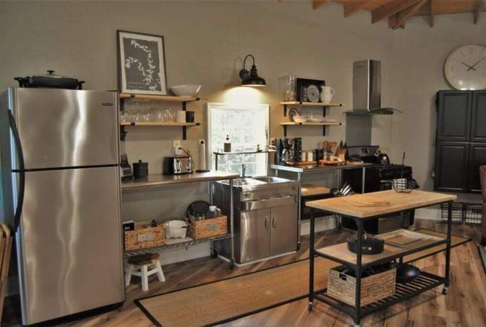 Open shelves are functional and provides ease accessing the kitchen items.