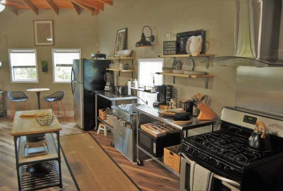 Kitchen fully stocked/equipped with dishes/pots/pans.  Also movable island.