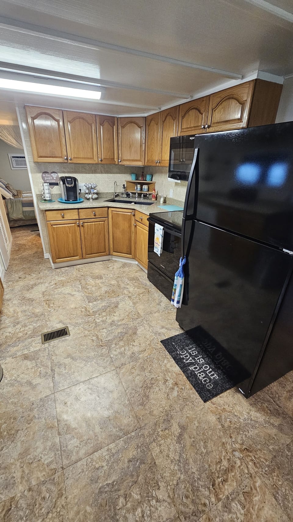 Kitchen, hallway leading to master bed room on the left