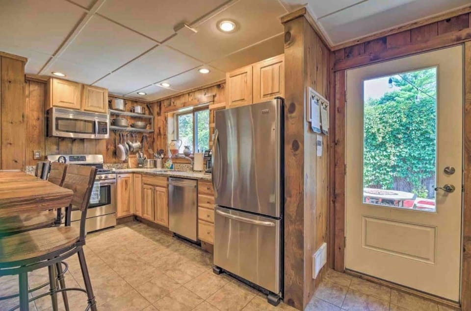 The kitchen includes a dishwasher and the stocked kitchen includes dishwasher tabs, dish soap and paper towels.