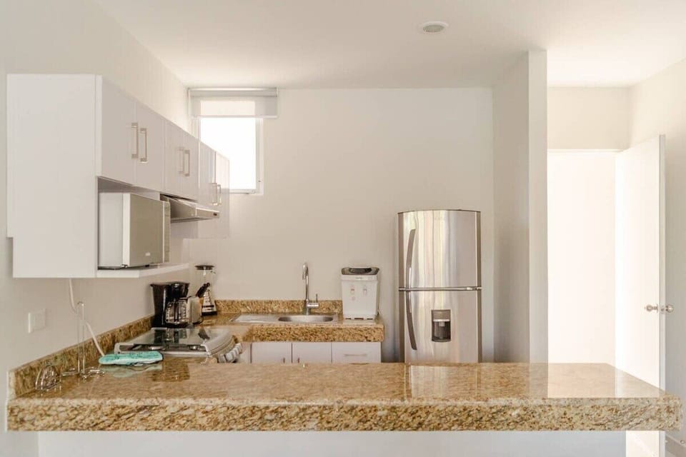 The traditional open concept for the kitchen, which comes equipped with everything needed.