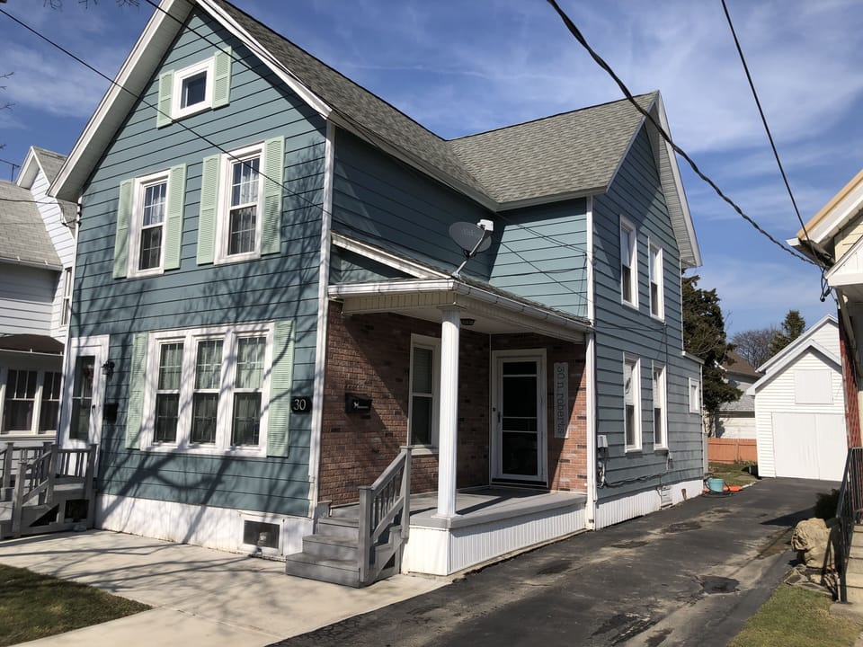 The house. This unit is the upper apartment with access on the front left side.