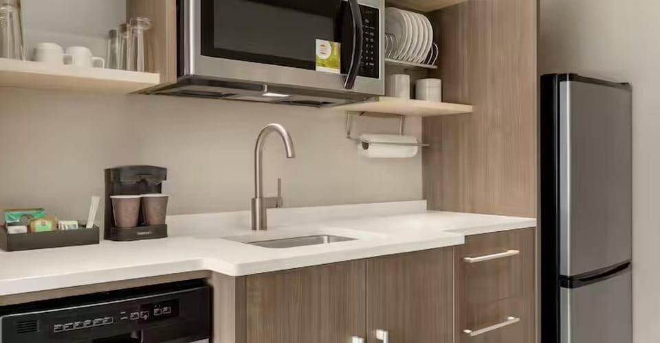 Cook and sip coffee easily in the sleek kitchenette.