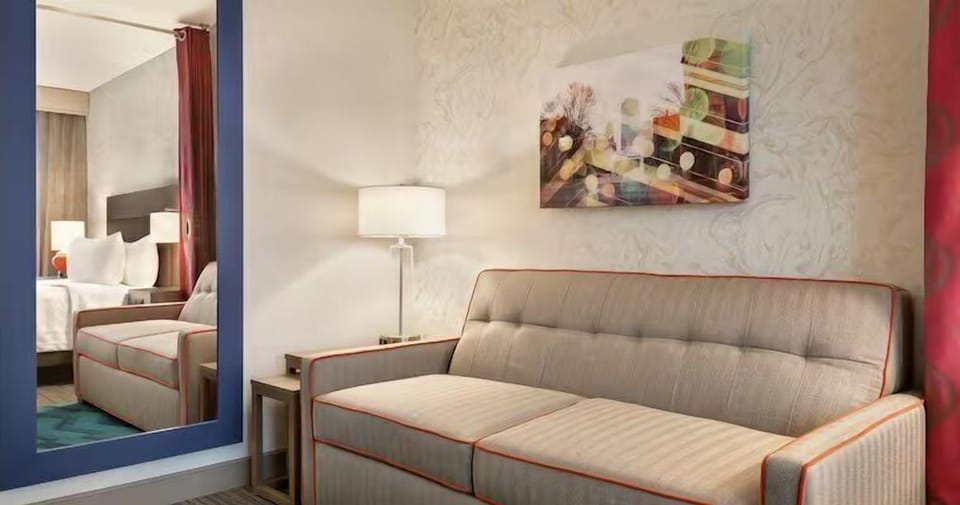 Unwind on the plush sofa after exploring the city.