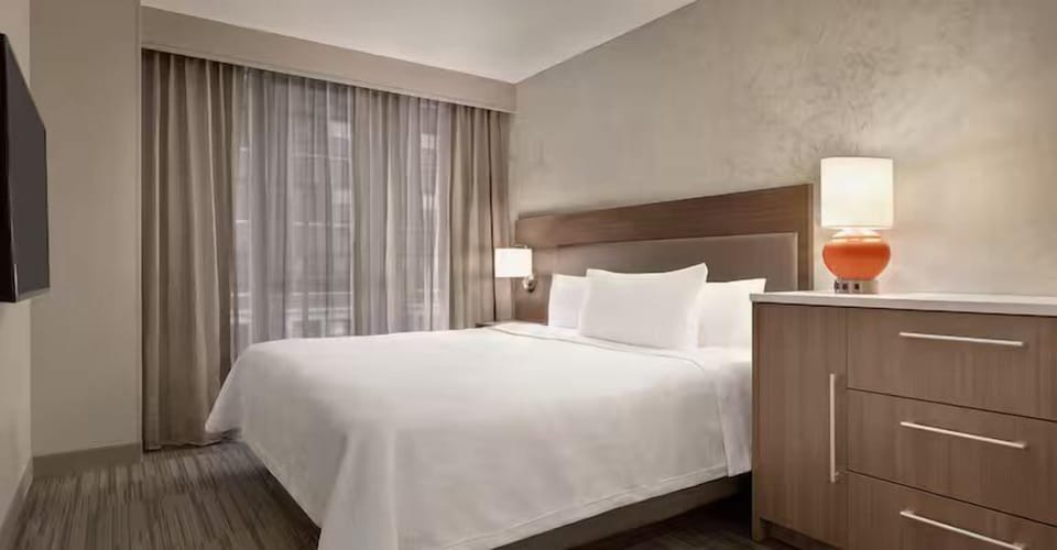 Unwind into crisp linens and a calm, restful night’s sleep.