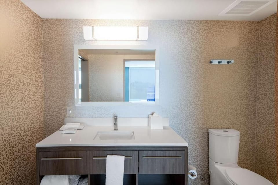 Refresh effortlessly at a bright vanity with plenty of counter space.
