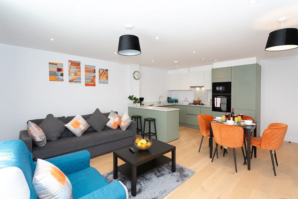 Tastefully decorated open plan living room dinning and kitchen area