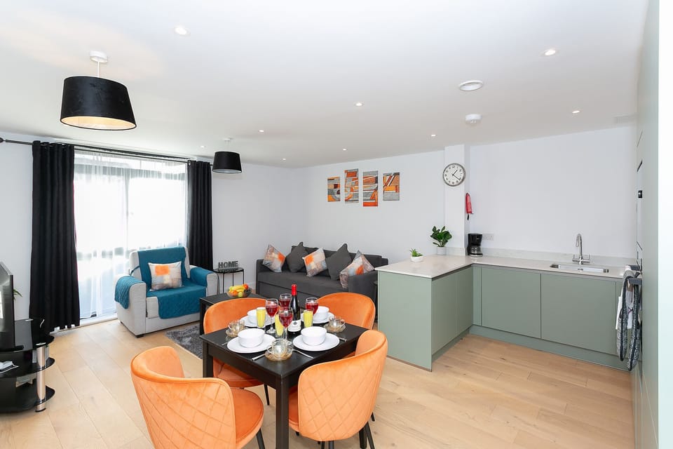 Tastefully decorated open plan living room dinning and kitchen area