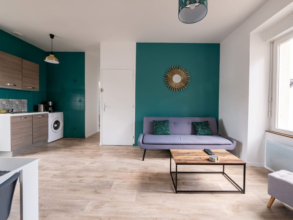 "Warm and Modern Living Room with Duck Green Wall"