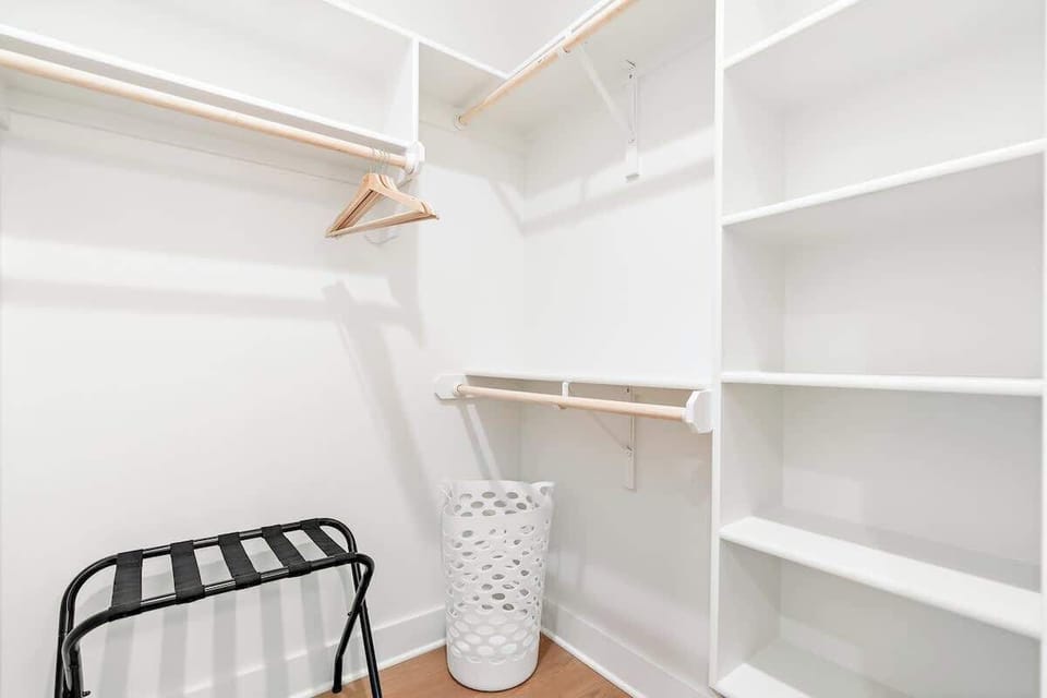 This walk-in closet is just off the private bathroom and is very spacious for guest use.