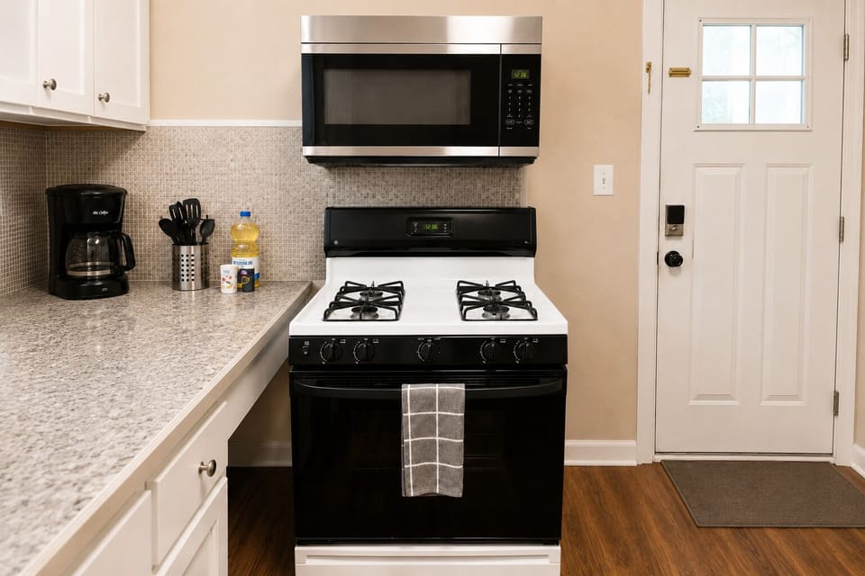 Full-size gas range and microwave, with keypad smart-lock entry just steps away