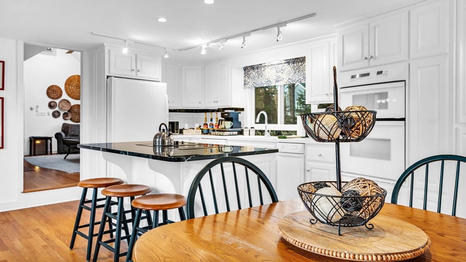 The secondary dining table in the kitchen seats four comfortably.