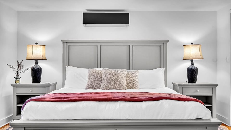 King bedroom - equipped with a dresser, a closet and an ensuite bathroom.