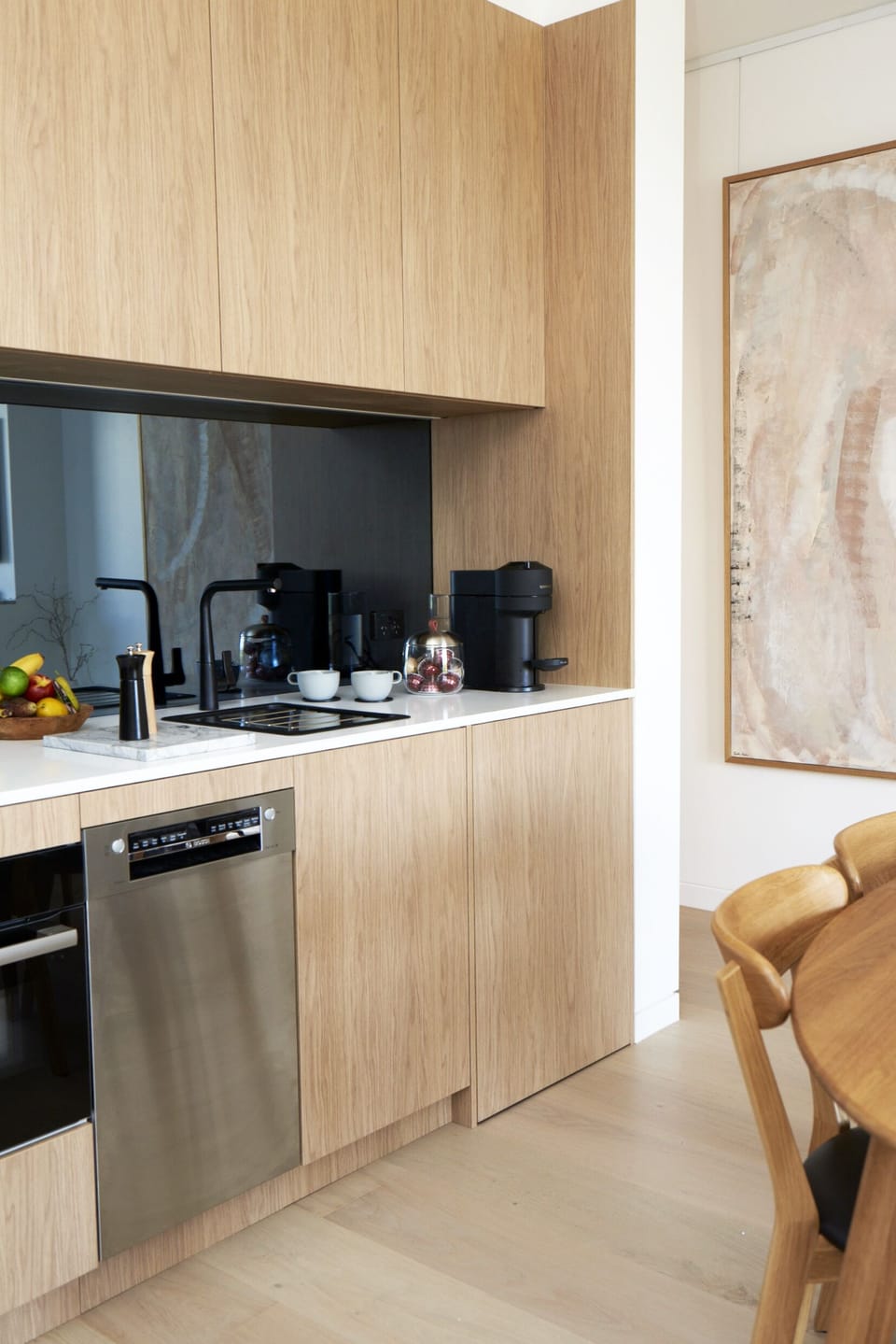 Kitchen w/ Bosch appliances induction cooktop, combi oven/microwave, dishwasher