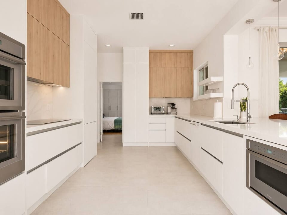 This sleek galley kitchen has everything you need to whip up breakfast before heading out for the day. Double ovens, a coffee station, and plenty of counter space make it easy to cook for the whole group without bumping elbows.