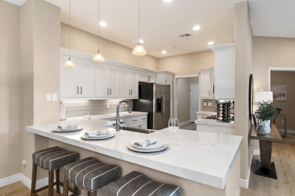 Fully stocked kitchen with gas stove, microwave/convection oven and dishwasher