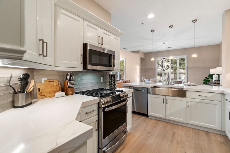 Remodeled kitchen with new appliances and quartz countertops