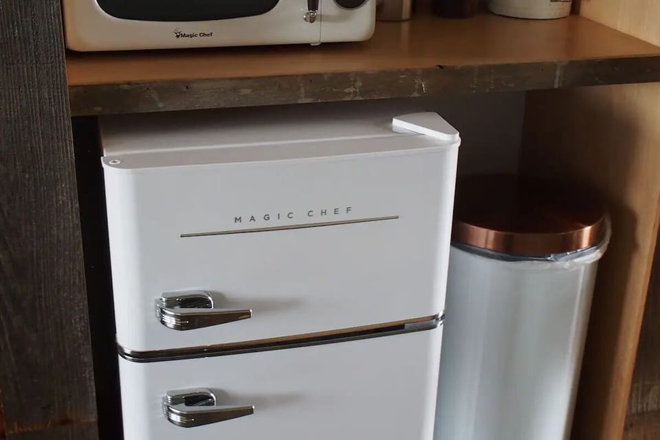 Stock snacks and chill drinks in the retro mini fridge.