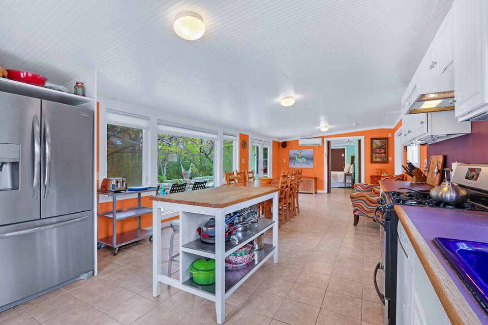 The kitchen is adjacent to the dining room
