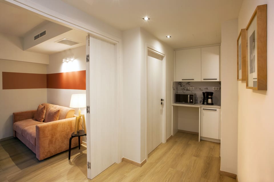 Doors fold and open up to comply with accessibility requirements.