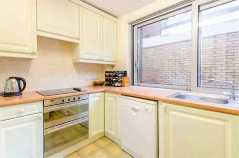 Separate kitchen with dishwasher, combined dryer/washing machine, microwave etc.