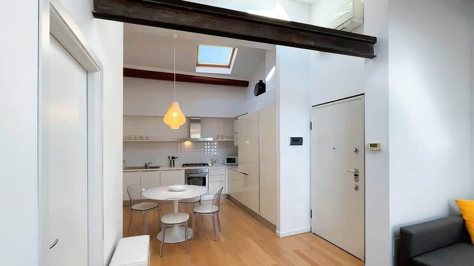 from the entrance, the space opens on the modern and well equipped kitchen